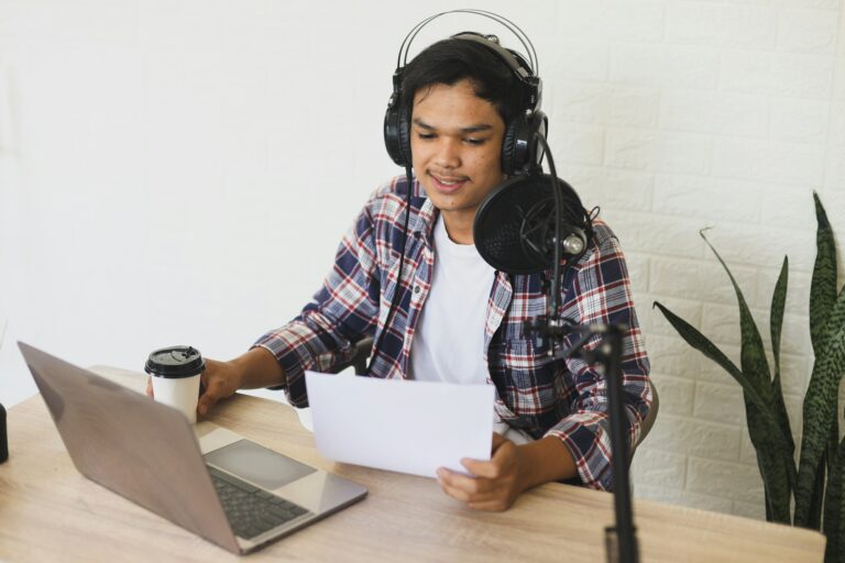 Radio announcer reading a news from paper at podcast